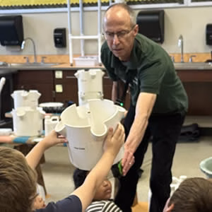 Steve teaching students how to grow on a hydroponic gardening system