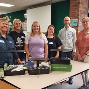 Teachers being training to grow on a LetPot hydroponic system